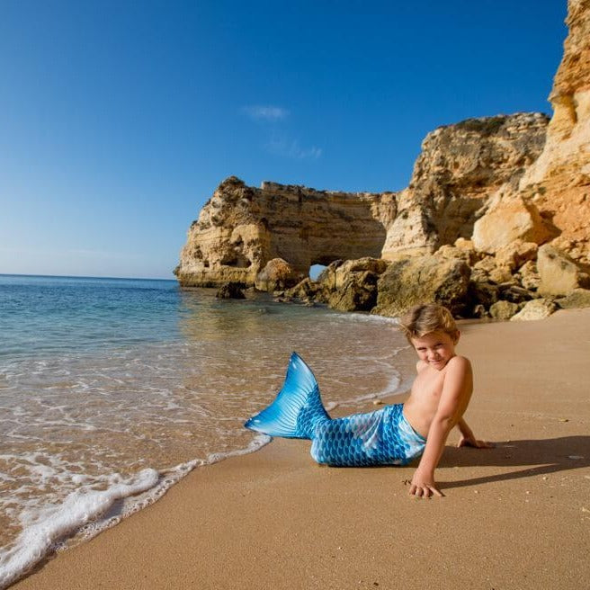 Boy-mermaid-at the beach-with-planet-mermaid