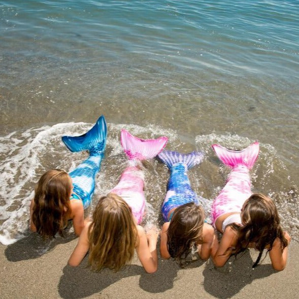 New Koi Collection mermaidens swim at the beach